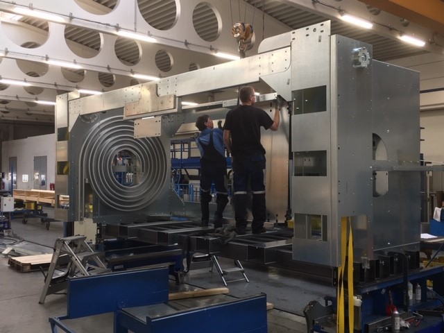EFAFLEX engineers building an XL high speed door headbox in the factory