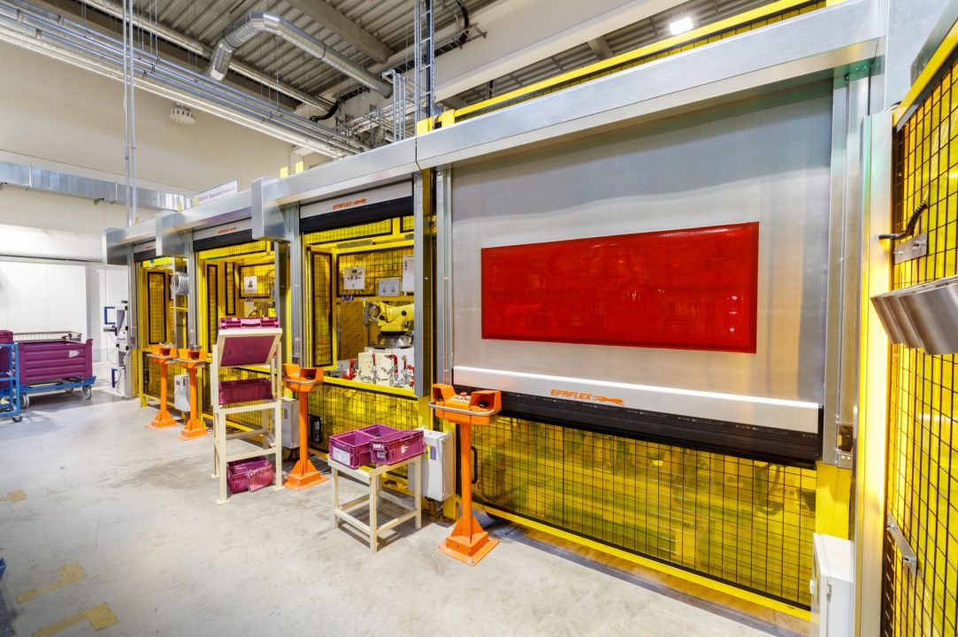 Machine Protection Fabric high speed roll-up door in use on a manufacturing safety guard opening