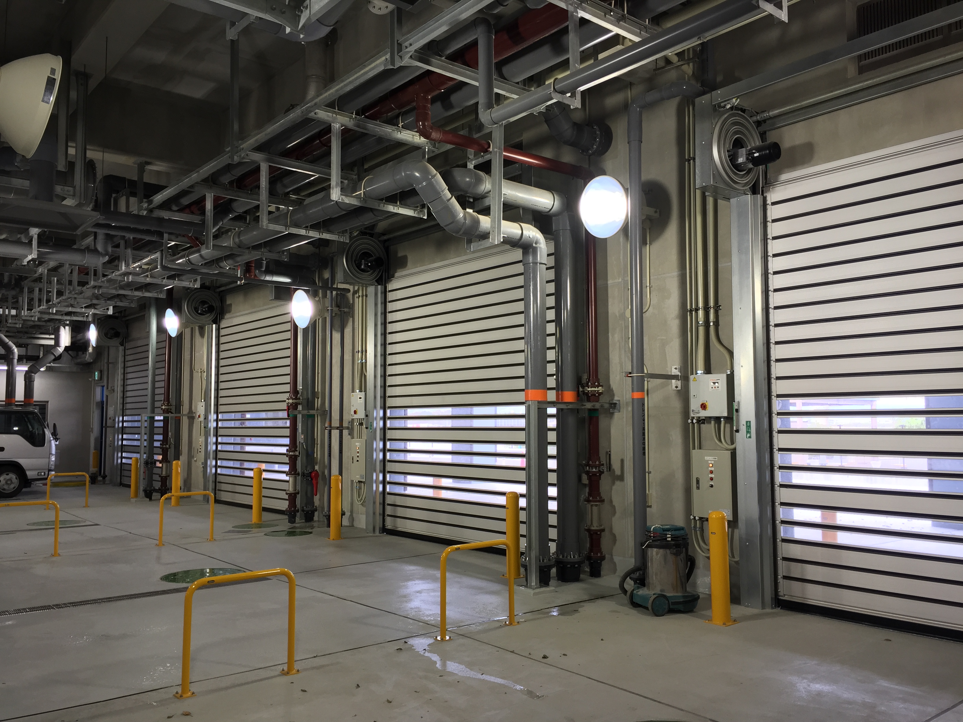 Row of EFAFLEX high speed doors inside a recycling and waste processing plant