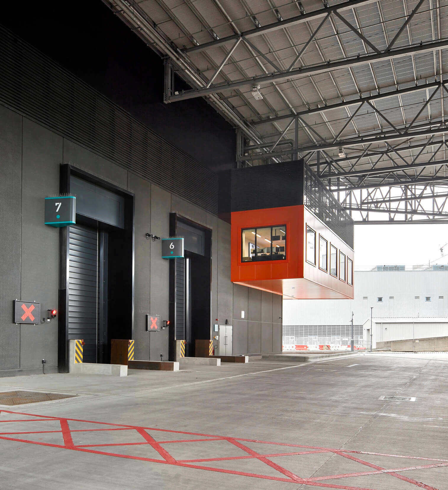 Modern waste management facility loading bays fitted with EFAFLEX high speed doors